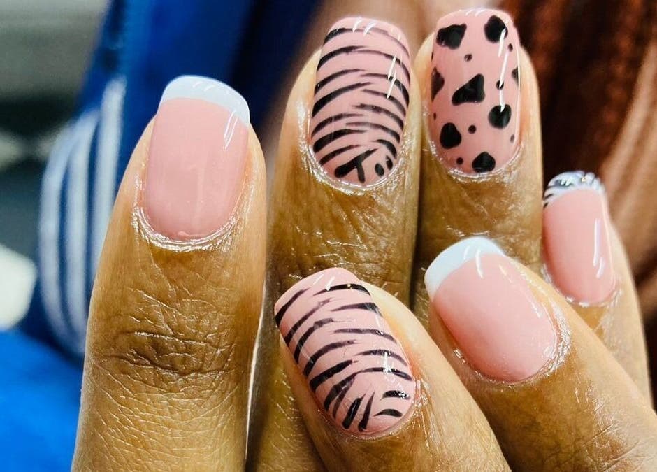Stylish nail art design at Zamabongwe Nails in Cape Town, Western Cape, ZA with pink and black patterns.