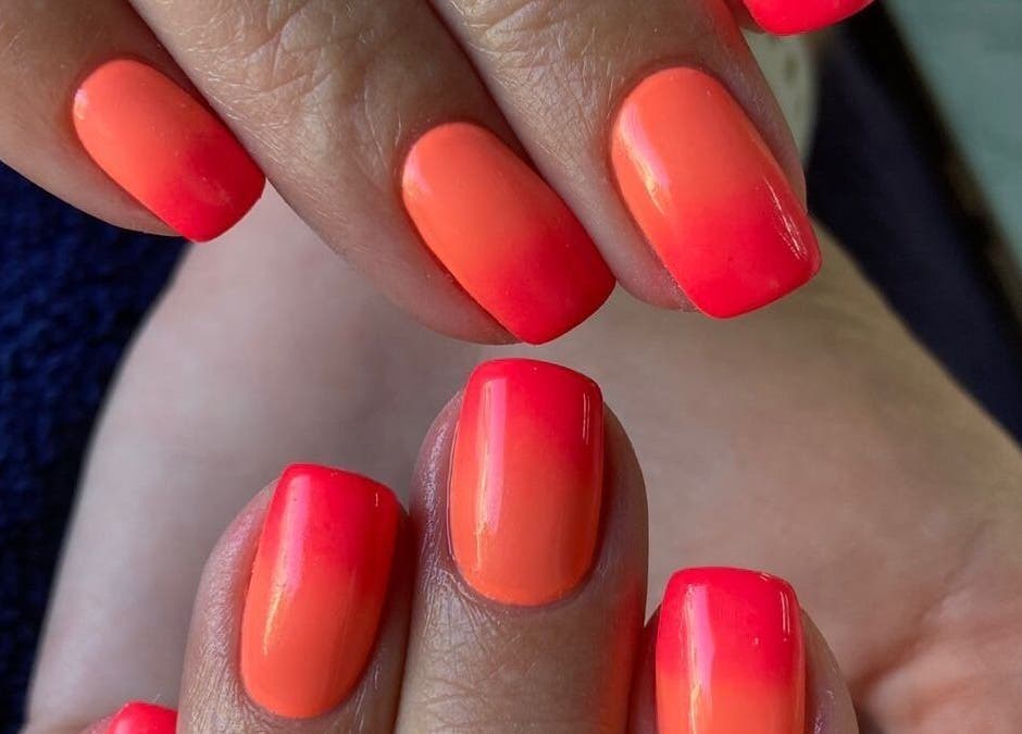 Bright orange nails at Zamabongwe Nails in Cape Town, Western Cape, ZA. Perfect for a vibrant manicure look.