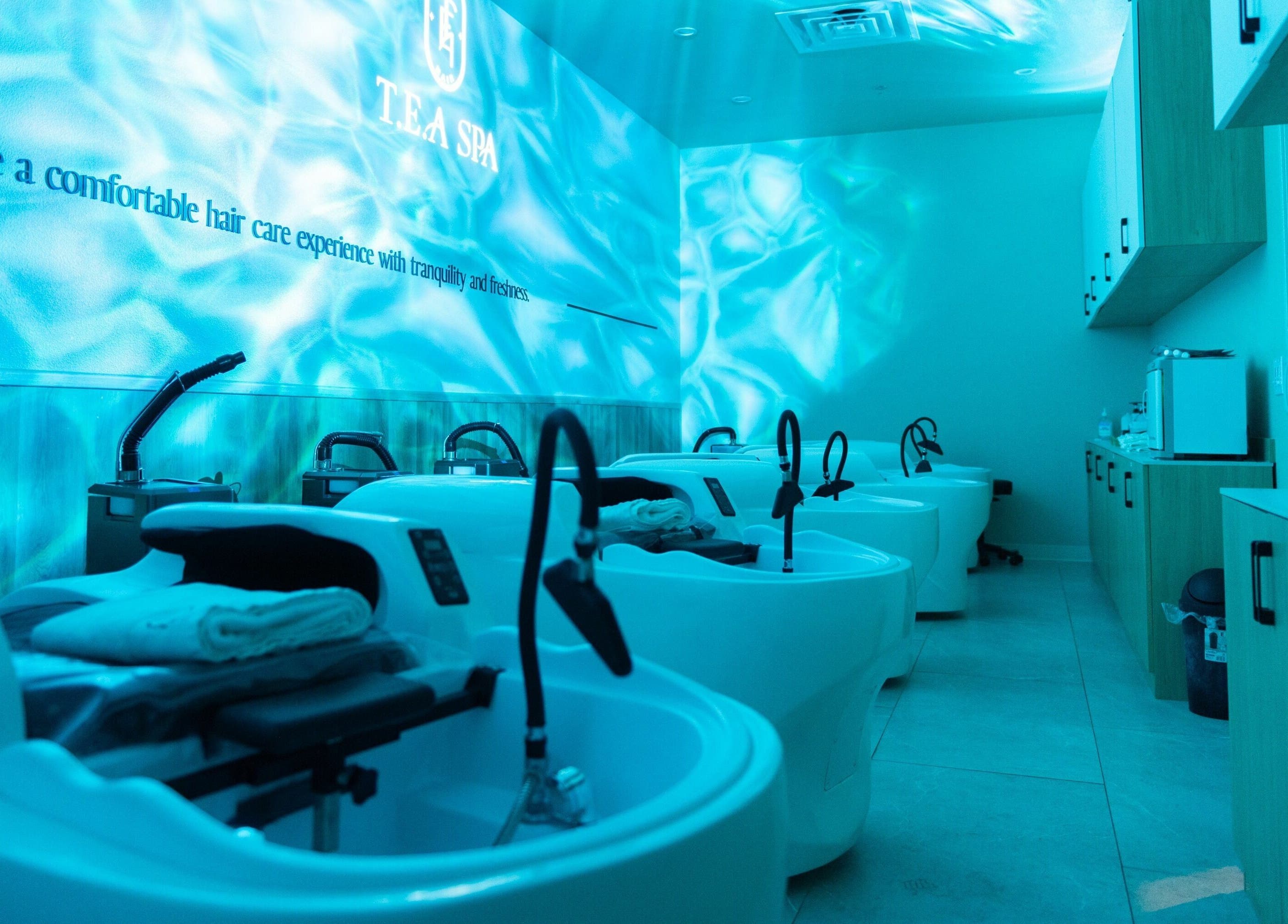 Relaxing wash station at Tea Scalp & Hair Spa, Las Vegas, Nevada, US with aqua lighting for tranquility.