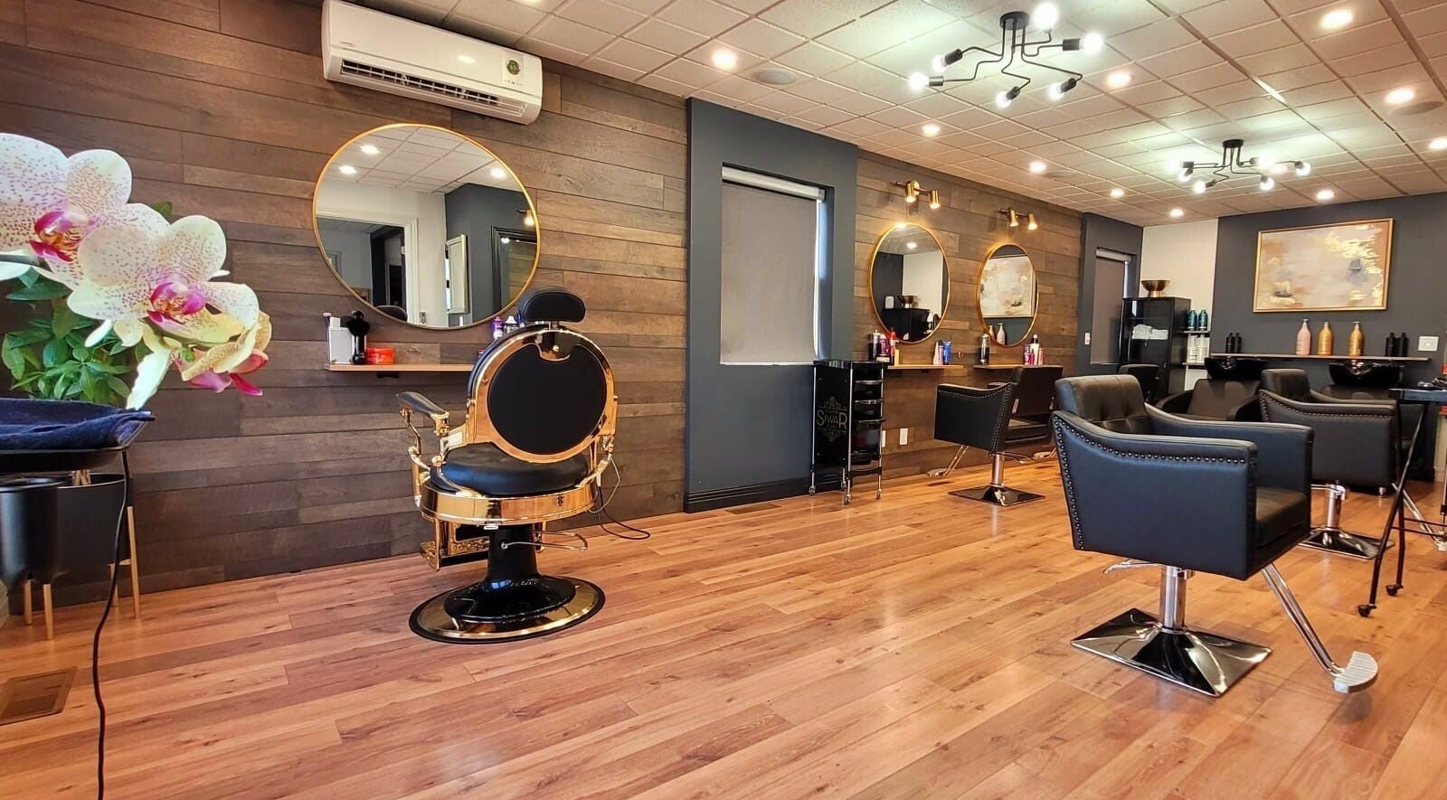 Chic salon interior at Style by Siwar Studio, Moncton, New Brunswick, CA, with modern decor and comfortable seating.