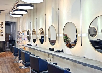 Elegant mirrors and styling chairs at Philosophy Studio in Singapore, Singapore, SG enhancing beauty experience.