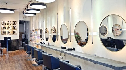 Elegant mirrors and styling chairs at Philosophy Studio in Singapore, Singapore, SG enhancing beauty experience.