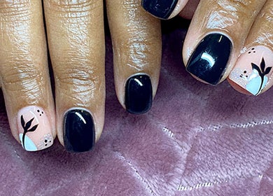 Stylish black and floral nails design at Azalea Beauty Spa, Tzaneen, Limpopo, ZA.