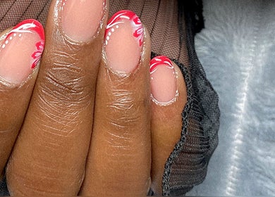 Elegant nail art with pink floral design at Azalea Beauty Spa, Tzaneen, Limpopo, ZA.