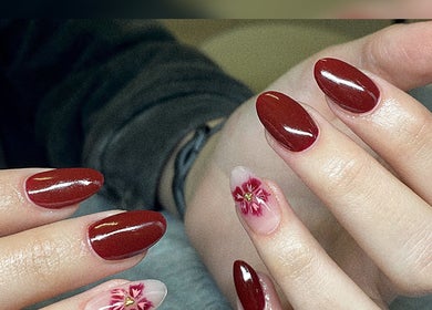 Elegant crimson nails with floral art at Azalea Beauty Spa, Tzaneen, Limpopo, ZA.