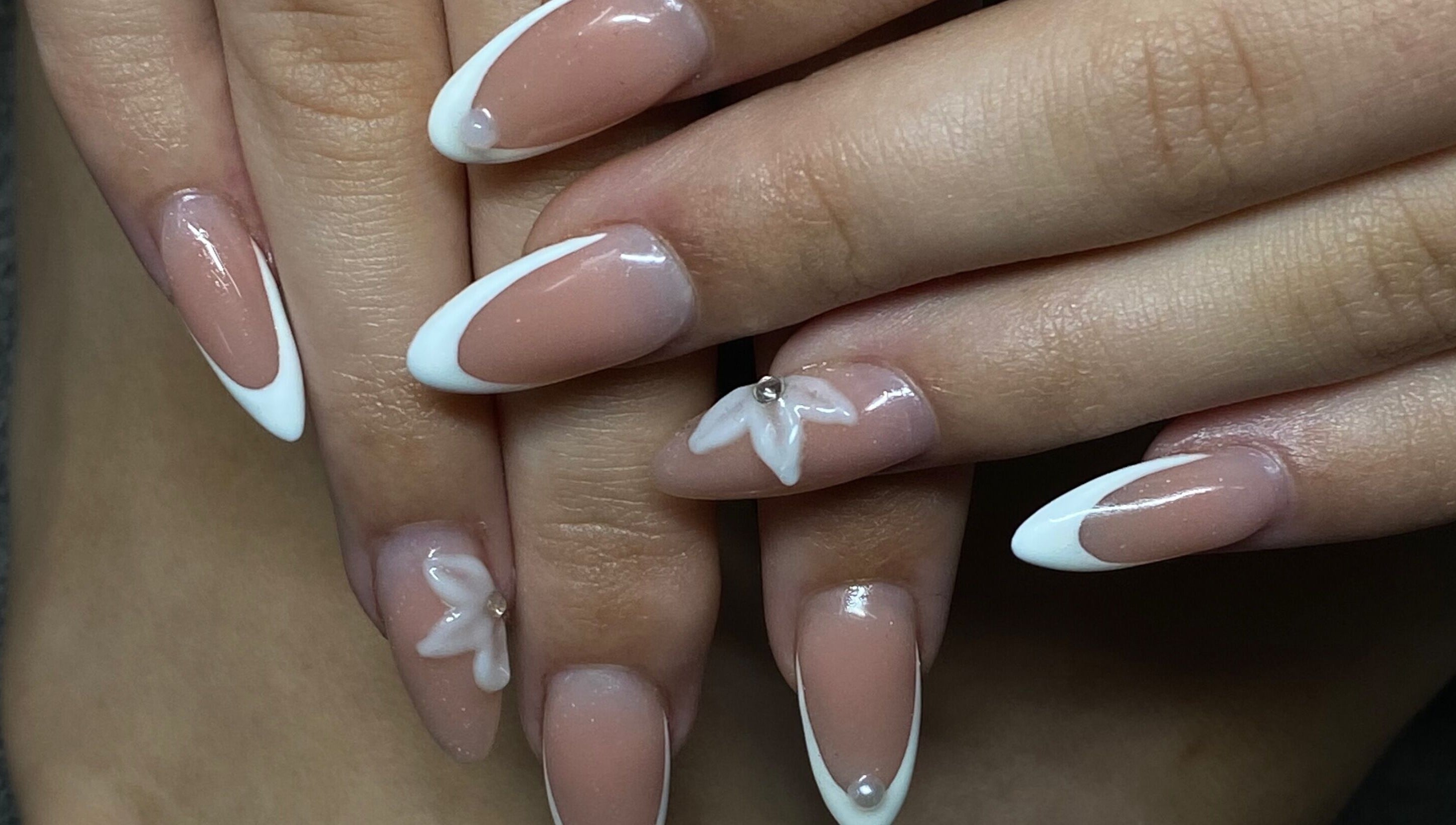 Elegant nail design with white tips and accents at Azalea Beauty Spa, Tzaneen, Limpopo, ZA.