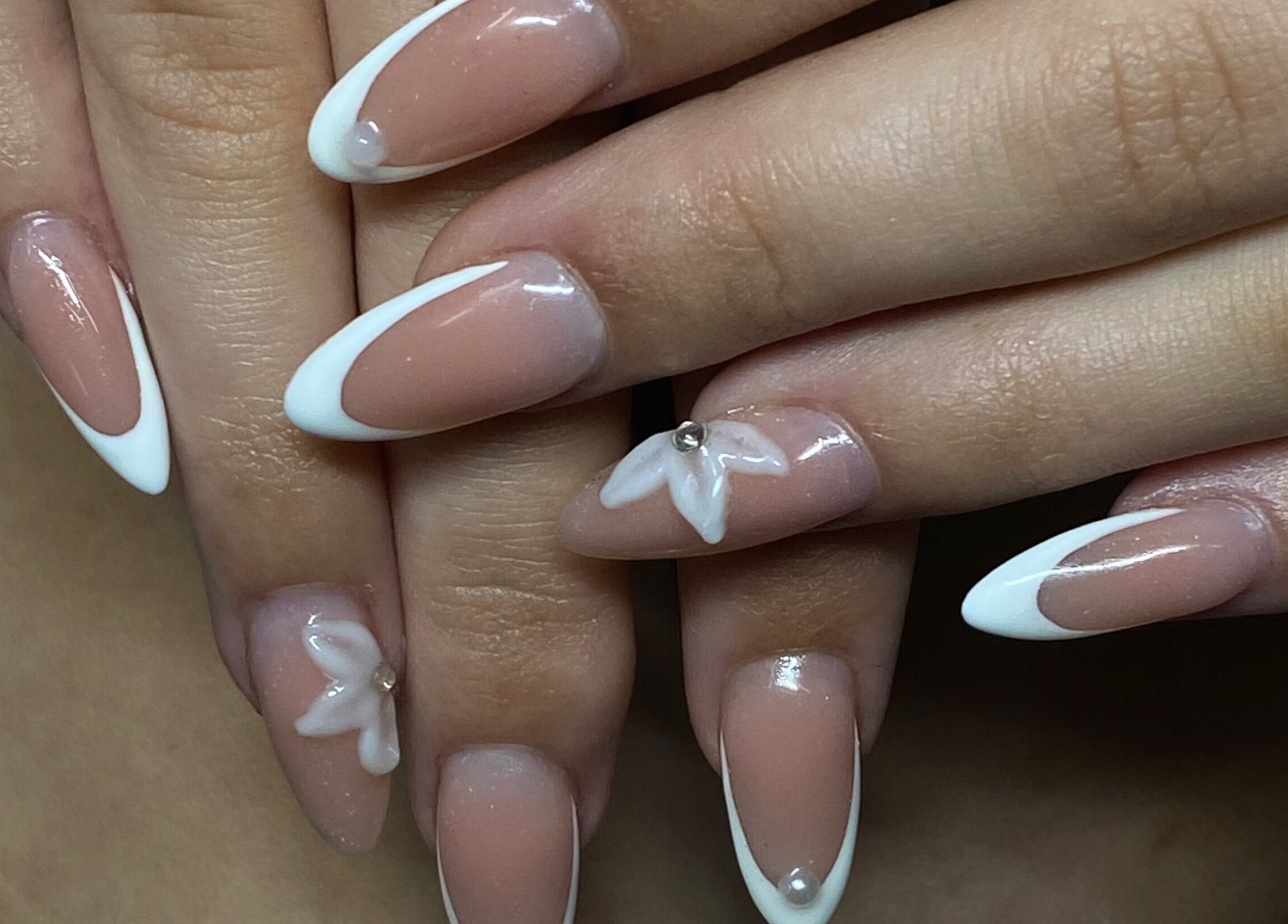 Elegant nail design with white tips and accents at Azalea Beauty Spa, Tzaneen, Limpopo, ZA.