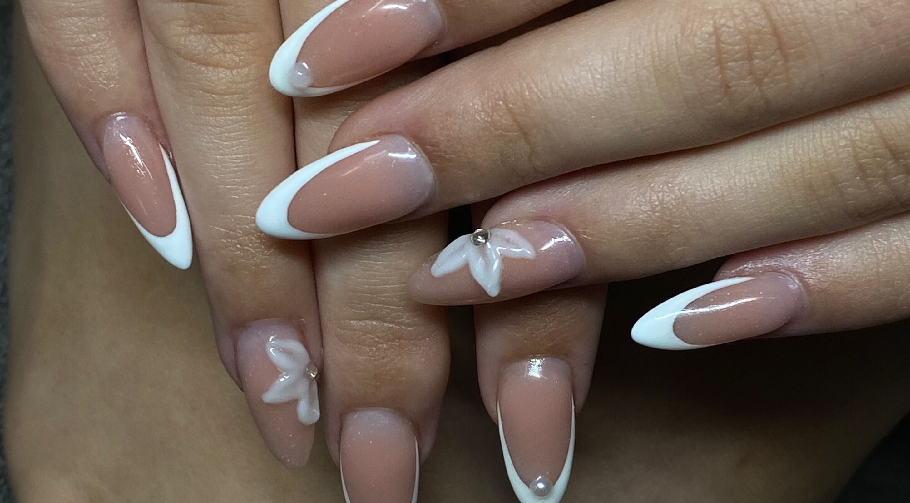 Elegant nail design with white tips and accents at Azalea Beauty Spa, Tzaneen, Limpopo, ZA.