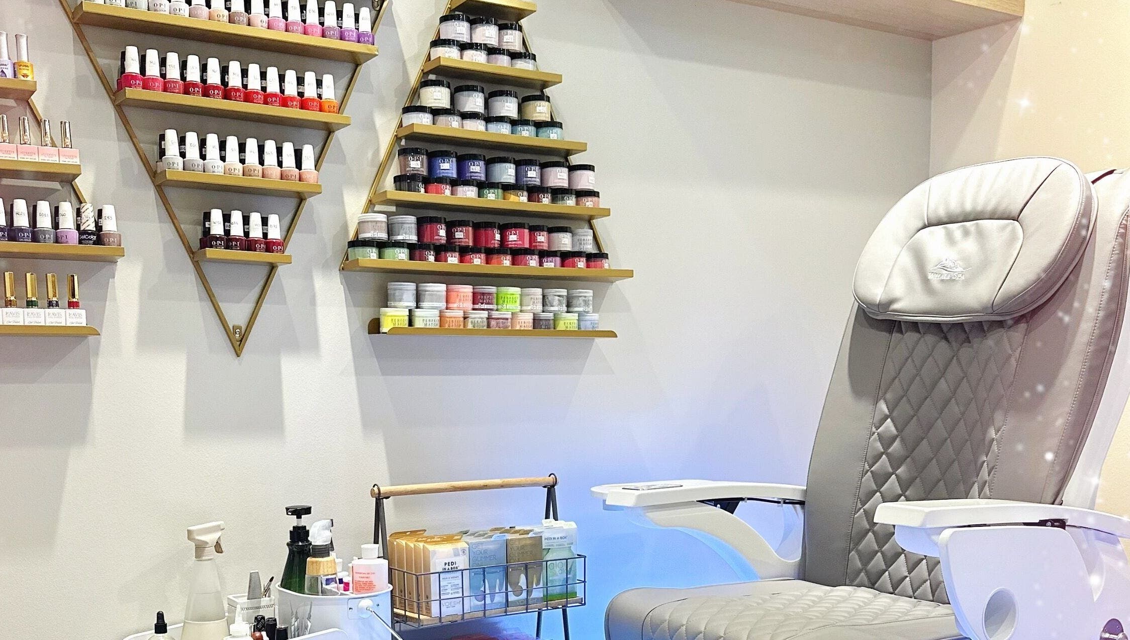 Glam E Nails salon in Arlington, Virginia, US features a luxurious pedicure chair and vibrant polish selection.