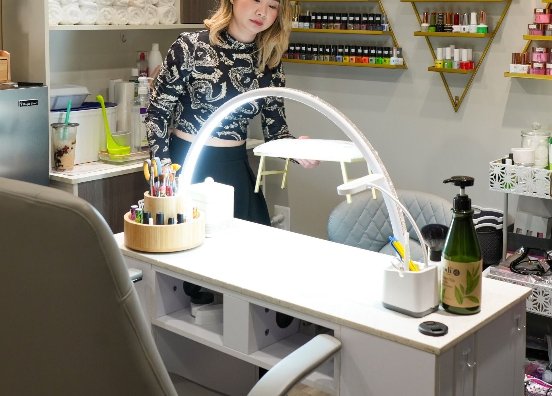 Chic interior of Glam E Nails, Arlington, Virginia, US, showcasing nail care products and cozy ambiance.