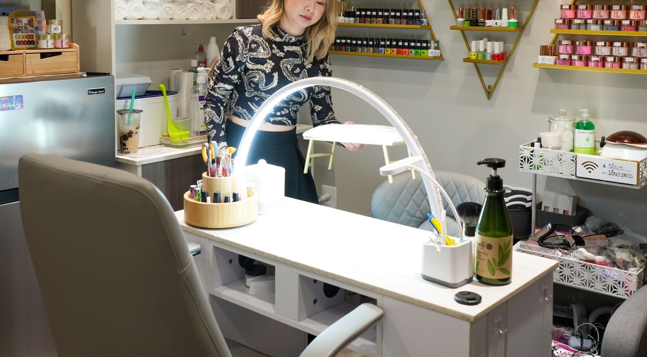 Chic interior of Glam E Nails, Arlington, Virginia, US, showcasing nail care products and cozy ambiance.