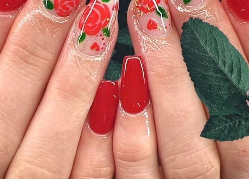 Elegant rose nail art at Glam E Nails, Arlington, Virginia. Perfect for beauty enthusiasts.