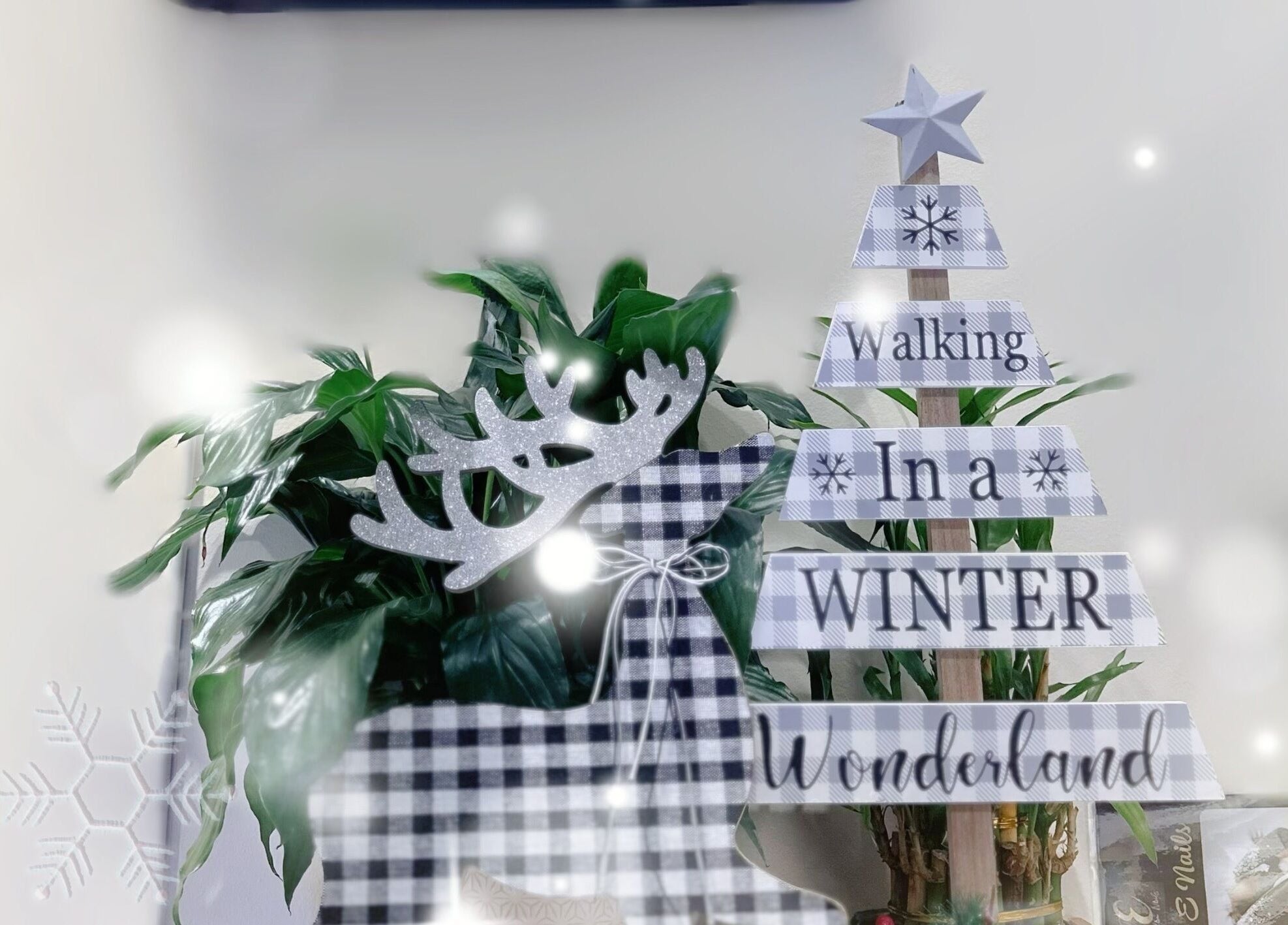 Festive décor at Glam E Nails in Arlington, Virginia, US with a reindeer and winter-themed sign.