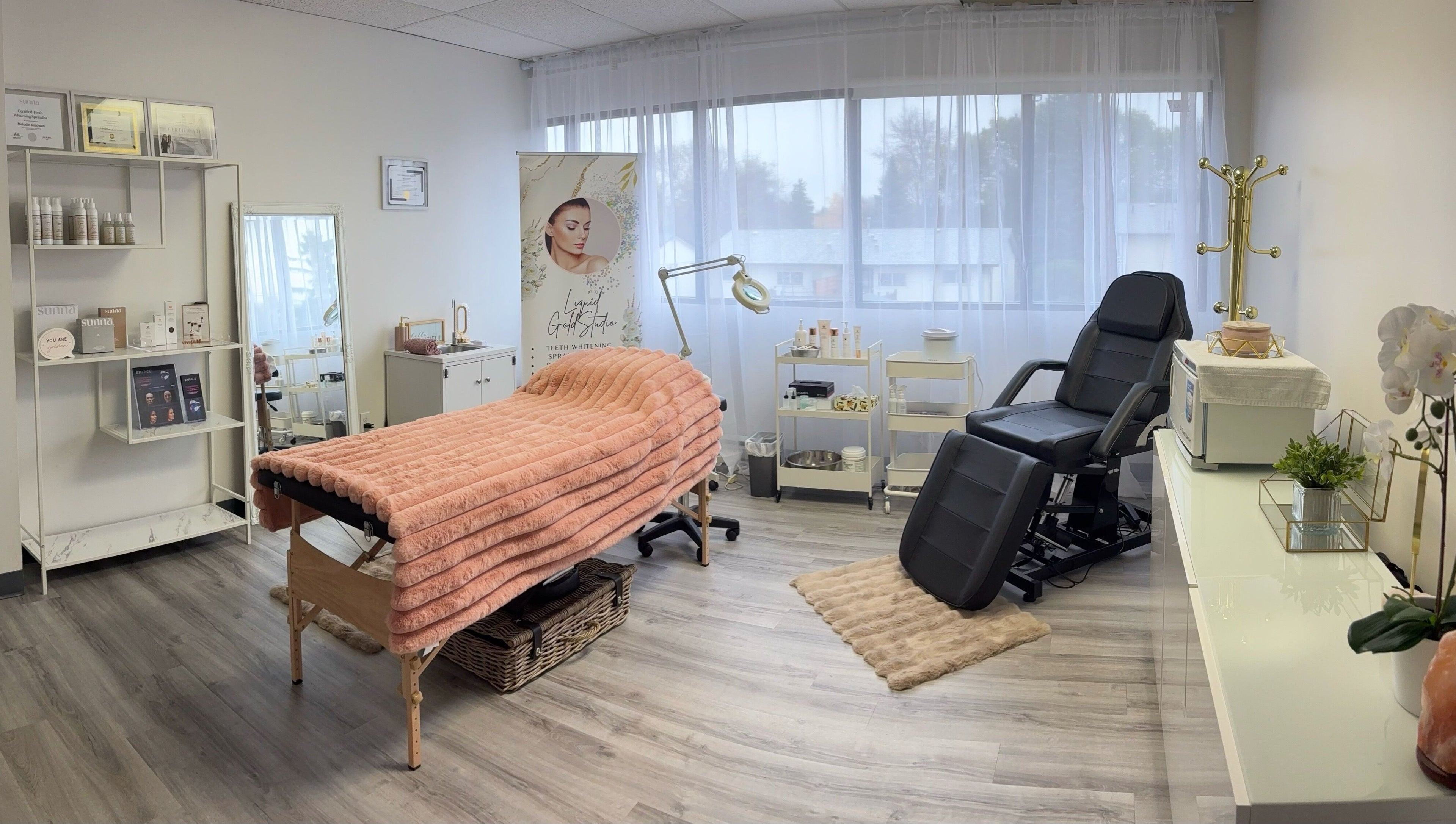 Tranquil treatment room at Liquid Gold Studio, Winnipeg, Manitoba, CA, featuring cozy decor and wellness essentials.