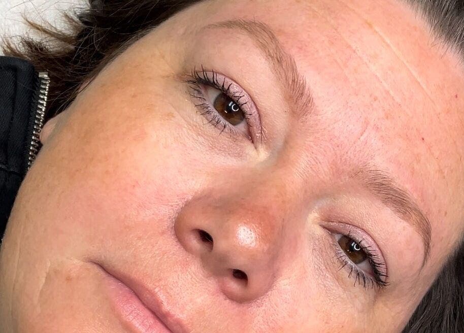 Close-up of a relaxed face at Liquid Gold Studio, Winnipeg, Manitoba, CA, showcasing skin clarity.