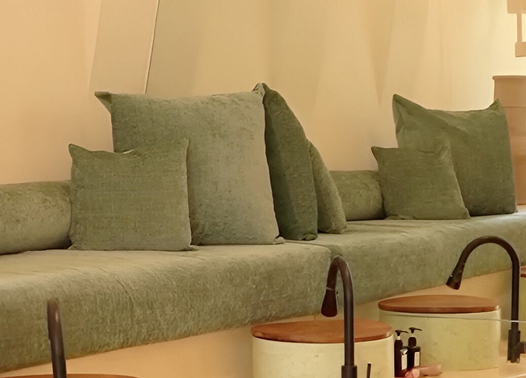 Luxurious green seating at Kind - Nails & Spa in Bali, Bali, ID offers tranquil relaxation.