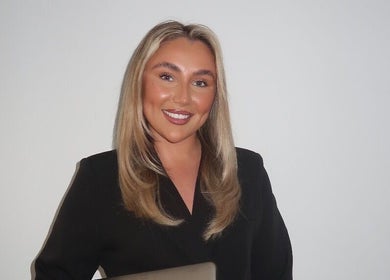 Smiling professional at Cosmetics By Chlo, Westhoughton, England, GB. Showcasing expertise and warmth.