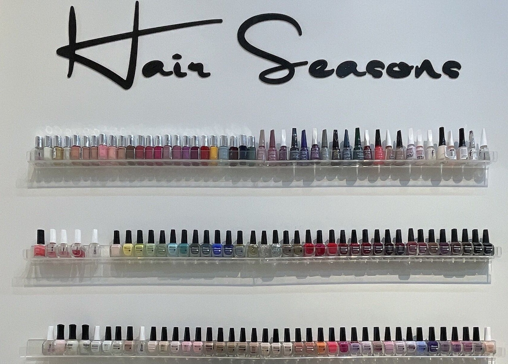Colorful nail polish display at Hair Seasons, الرياض, منطقة الرياض, SA showcasing a variety of hues.