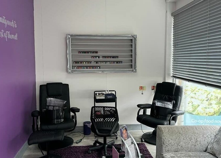 Relaxing spa chairs in Mirror Mirror, Aylesford, England, GB with purple accents and natural lighting.