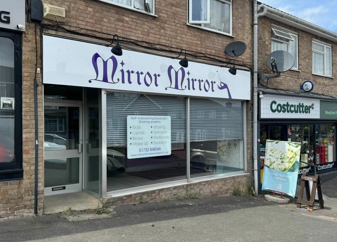 Exterior of Mirror Mirror beauty salon located in Aylesford, England, GB, showcasing its elegant signage.