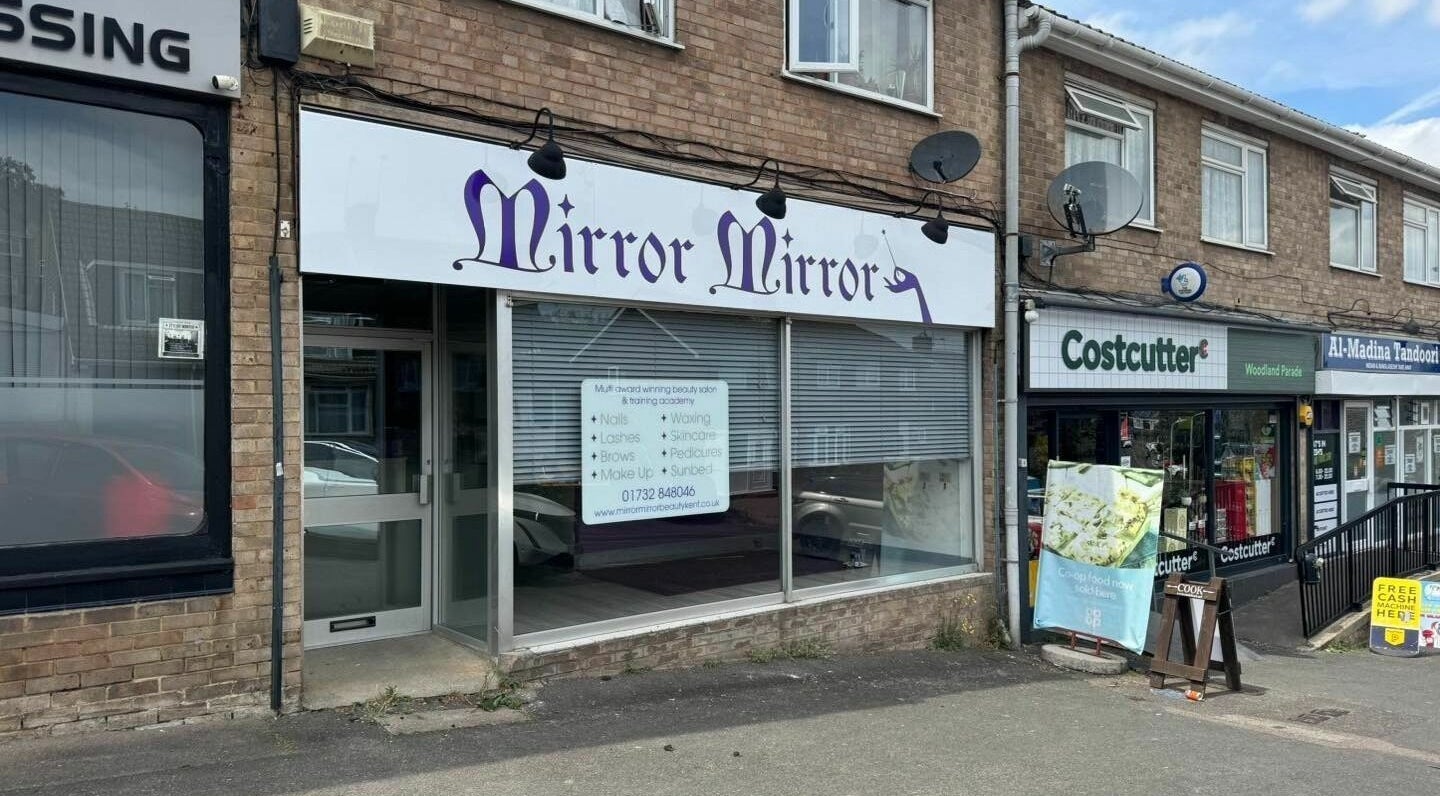 Exterior of Mirror Mirror beauty salon located in Aylesford, England, GB, showcasing its elegant signage.