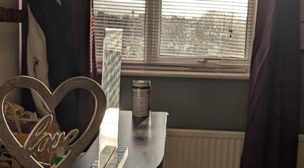 Warm and inviting corner in Hilot Sport Massage Therapy, Melksham, England, GB, with heart-shaped decor.