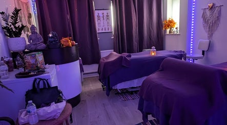 Relaxing massage room at Hilot Sport Massage Therapy in Melksham, England, GB with cozy lighting and decor.