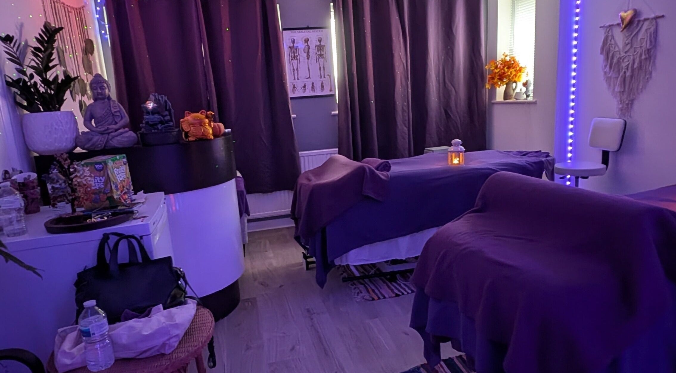 Relaxing massage room at Hilot Sport Massage Therapy, Melksham, England, GB, featuring ambient lighting.