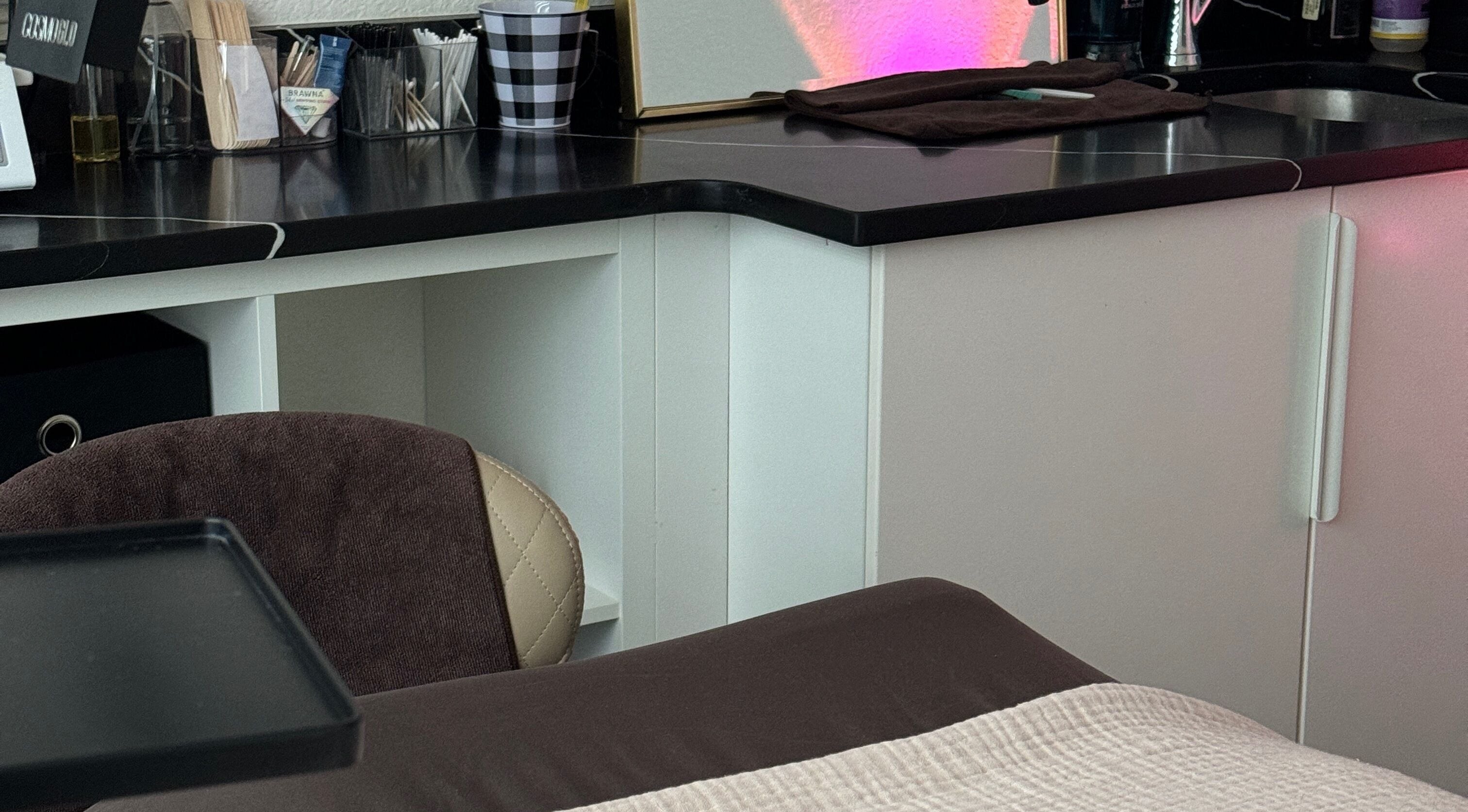 Dermabelle Esthetics treatment room in Tampa, Florida, US with a cozy and professional setup.