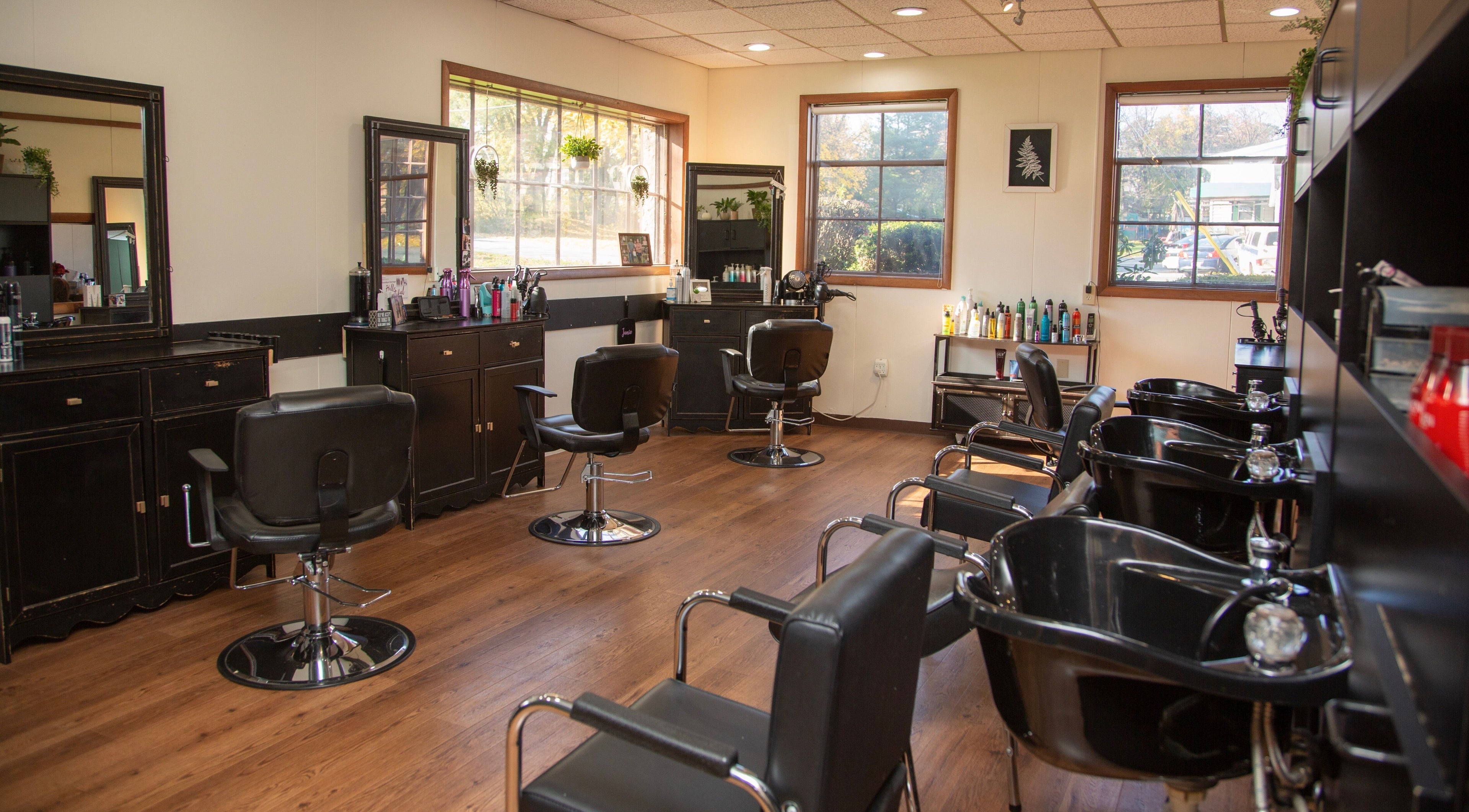 Chic interior of Hair Lounge 717 on Willow Street, Pennsylvania, US, showcasing styling chairs and mirrors.