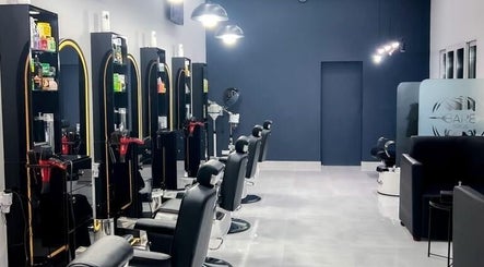 Sleek interior of Barb Bros salon in Dubai, Dubai, AE, featuring modern styling chairs and equipment.