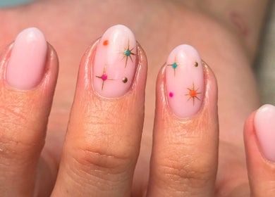 Elegant nail art with stars and colors at LMBEAUTY, Linwood, Scotland, GB, showcasing intricate design.