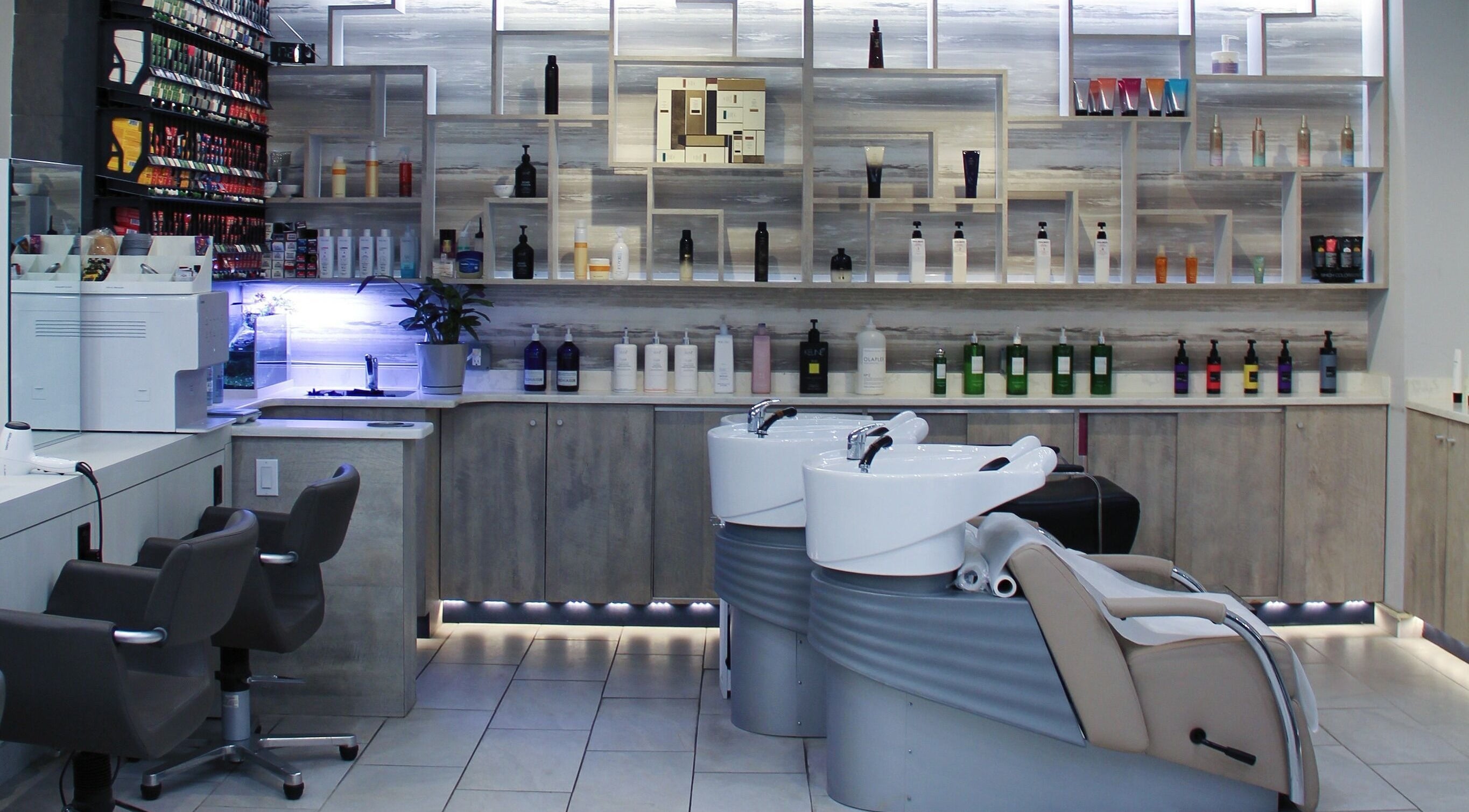 Elegant styling stations and shelves at Nova Salon in New York, New York, US showcase modern beauty design.