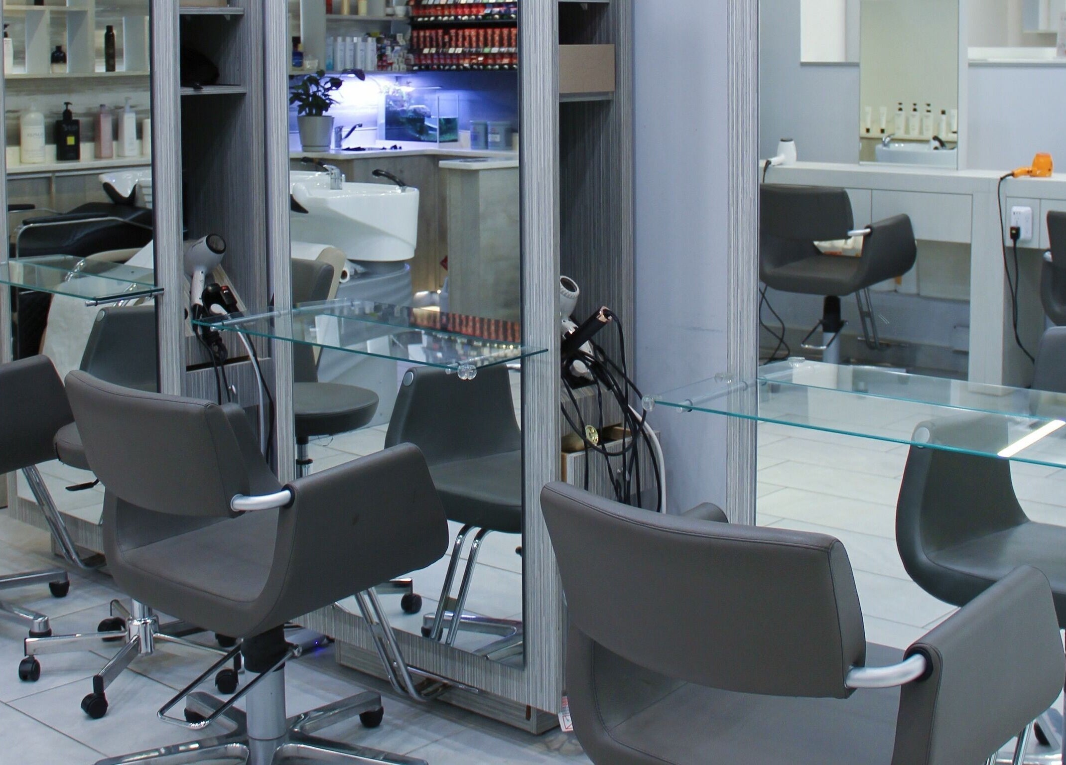 Modern styling chairs at Nova Salon, New York, New York, US, showcasing a sleek and inviting atmosphere.