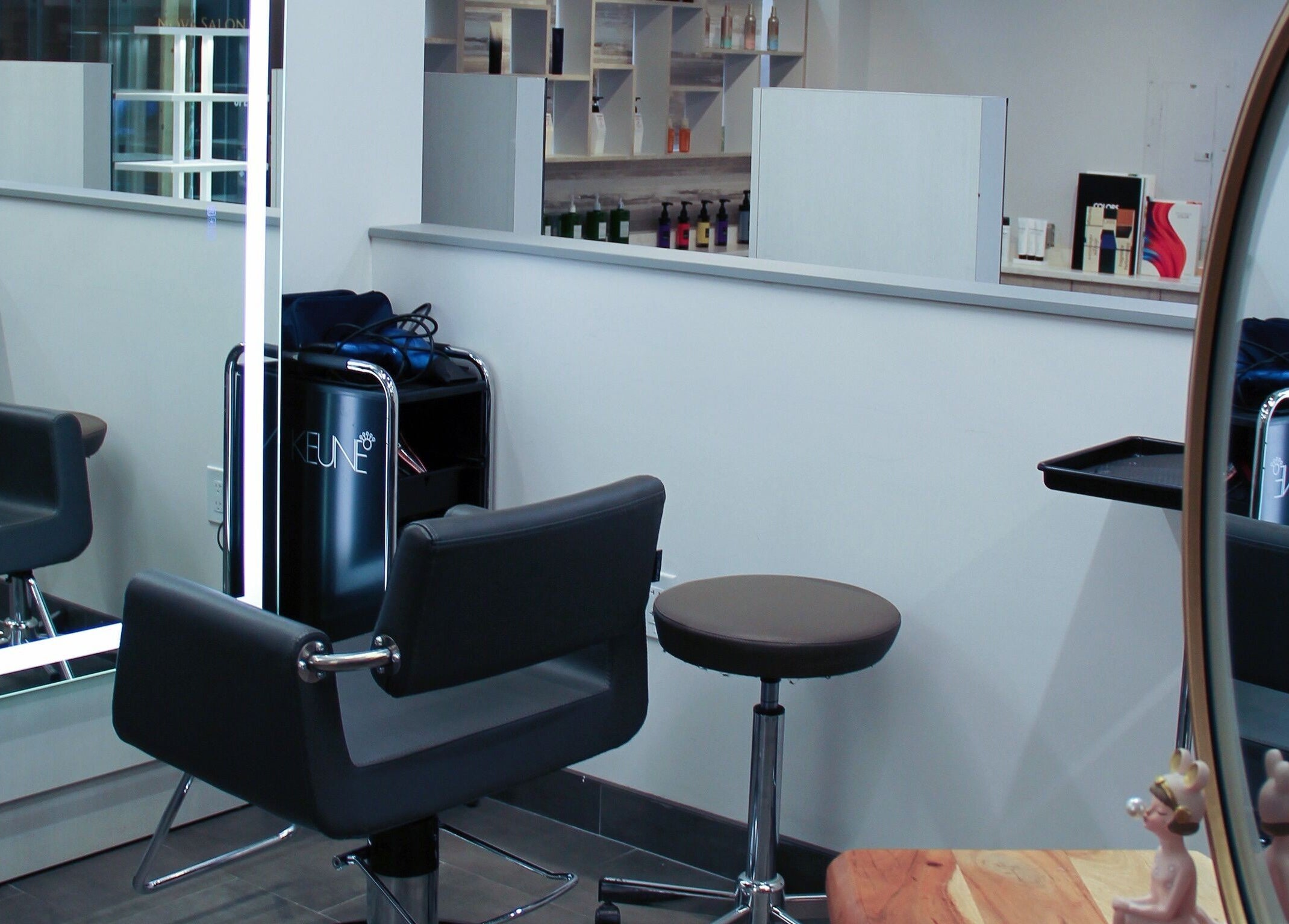 Modern salon chair and mirror at Nova Salon, New York, New York, US.