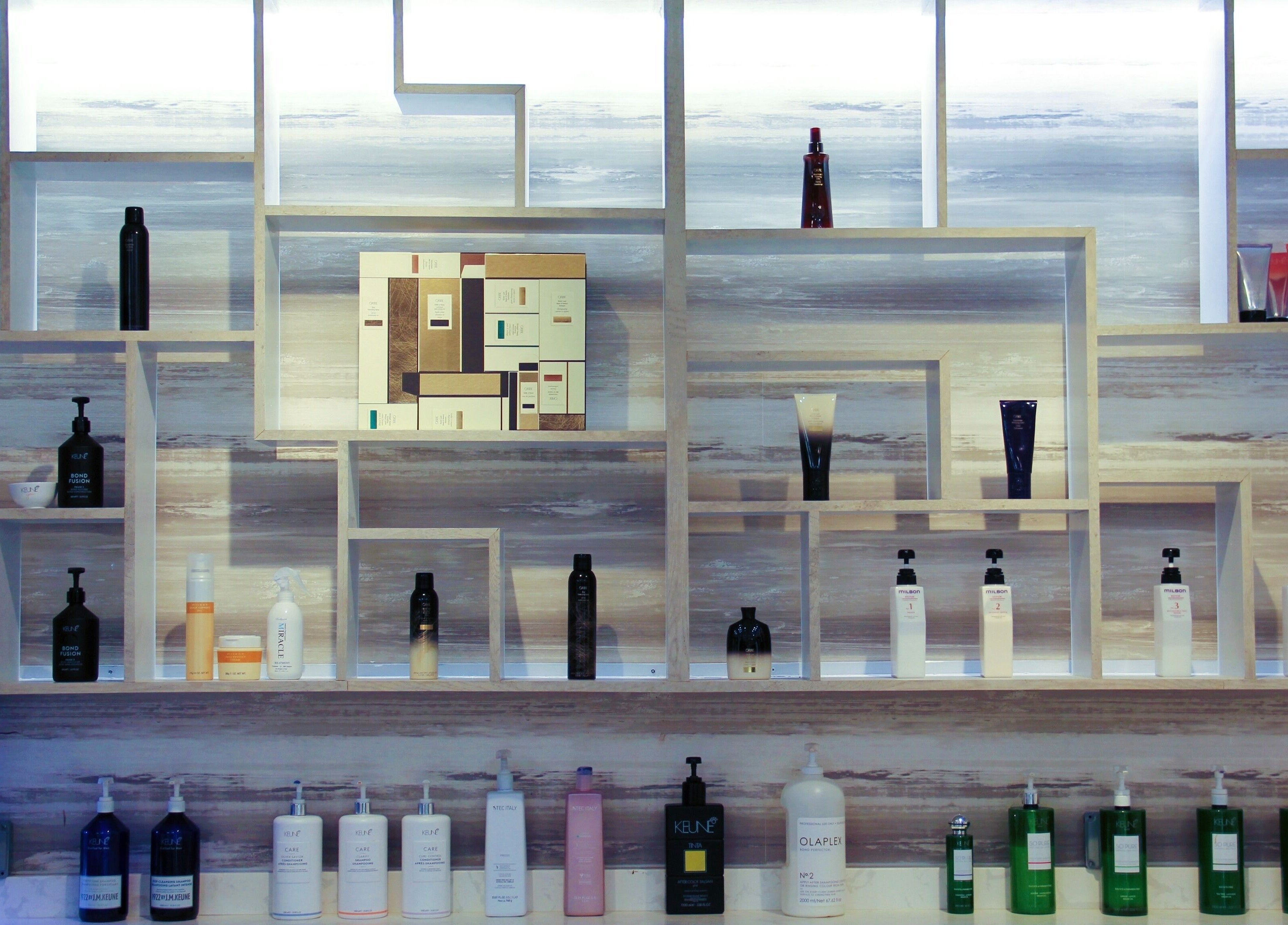 Elegant shelves display at Nova Salon in New York, New York, US, featuring premium beauty products.