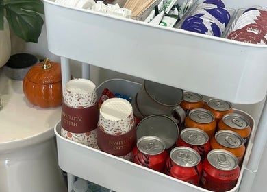 Refreshment counter with drinks and cups at Millie Cooper Nails, Failsworth, England, GB.