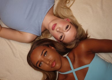 Two individuals in stylish tops at Tiarna Edwards Beautee, Rugby, England, GB, showcase beauty and wellness.