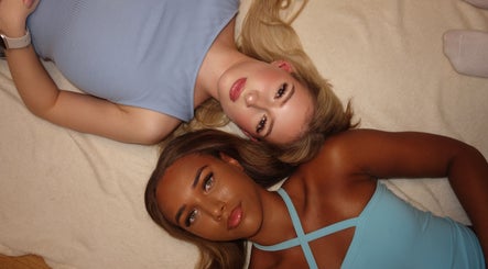 Two individuals in stylish tops at Tiarna Edwards Beautee, Rugby, England, GB, showcase beauty and wellness.