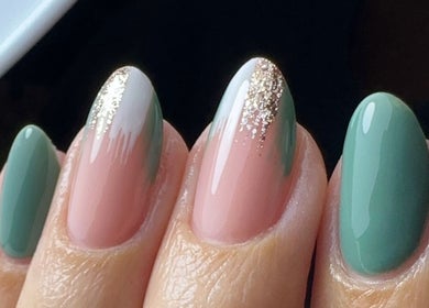 Elegant nail art by Leah Robinson Nail Artist, Cardiff, Wales, GB featuring chic green and nude tones with glitter.