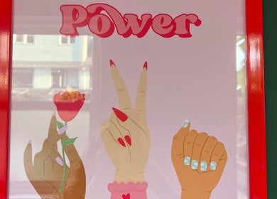 Colorful nail art poster with the word 'Power' at Pretty Please, Bristol, England, GB.