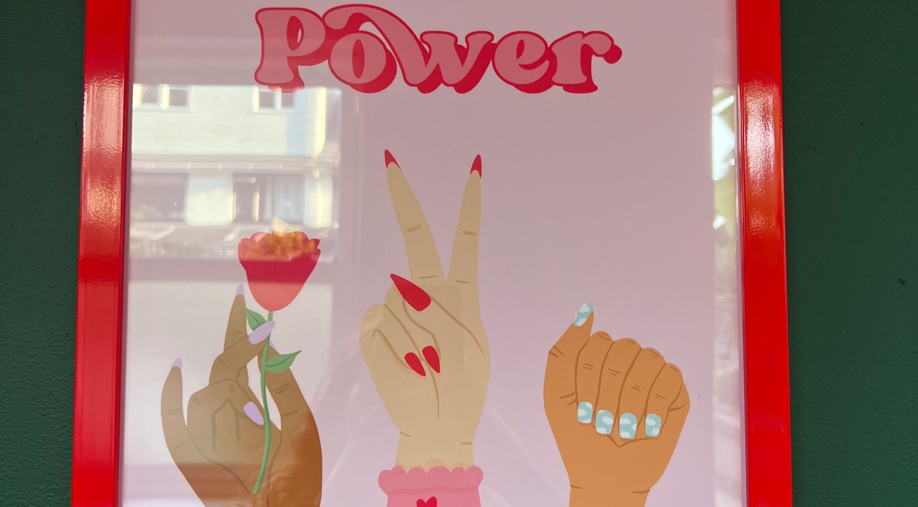 Colorful nail art poster with the word 'Power' at Pretty Please, Bristol, England, GB.