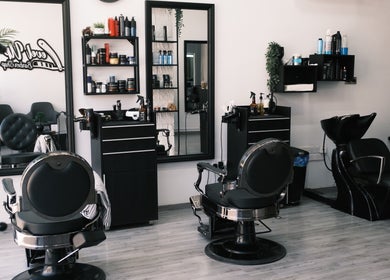 Interior of Level Up Barber Shop in Egkomi, Nicosia, CY showing stylish barber chairs and grooming products.