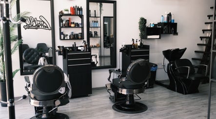 Interior of Level Up Barber Shop in Egkomi, Nicosia, CY showing stylish barber chairs and grooming products.