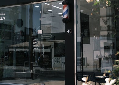 Entrance to Level Up Barber Shop in Egkomi Nicosia CY with modern glass facade.