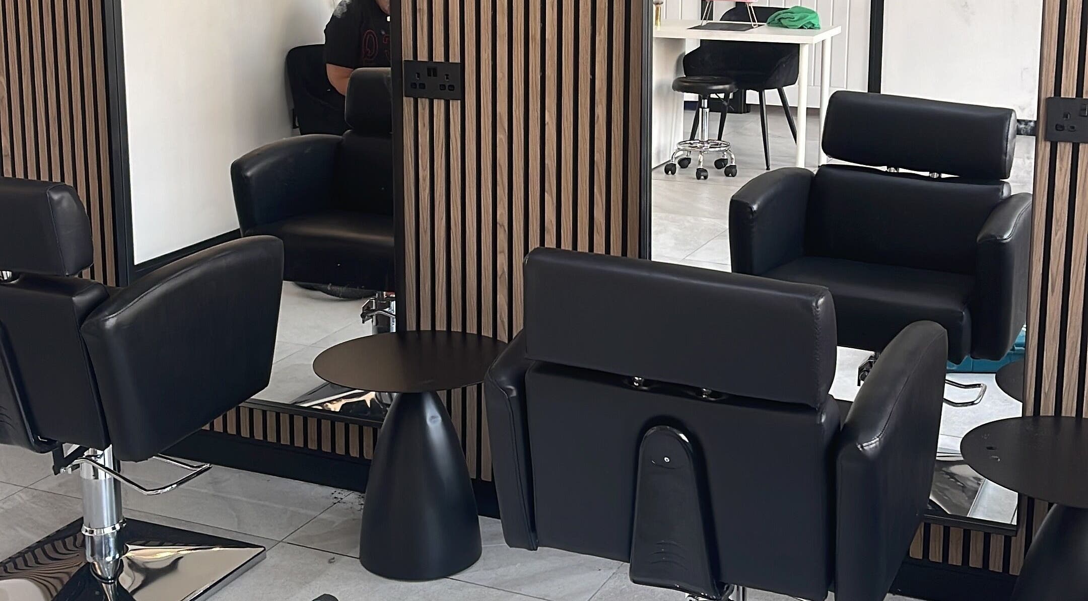 Modern salon chairs and mirrors at Glow Salon in Salford, England, GB, reflecting luxury and comfort.