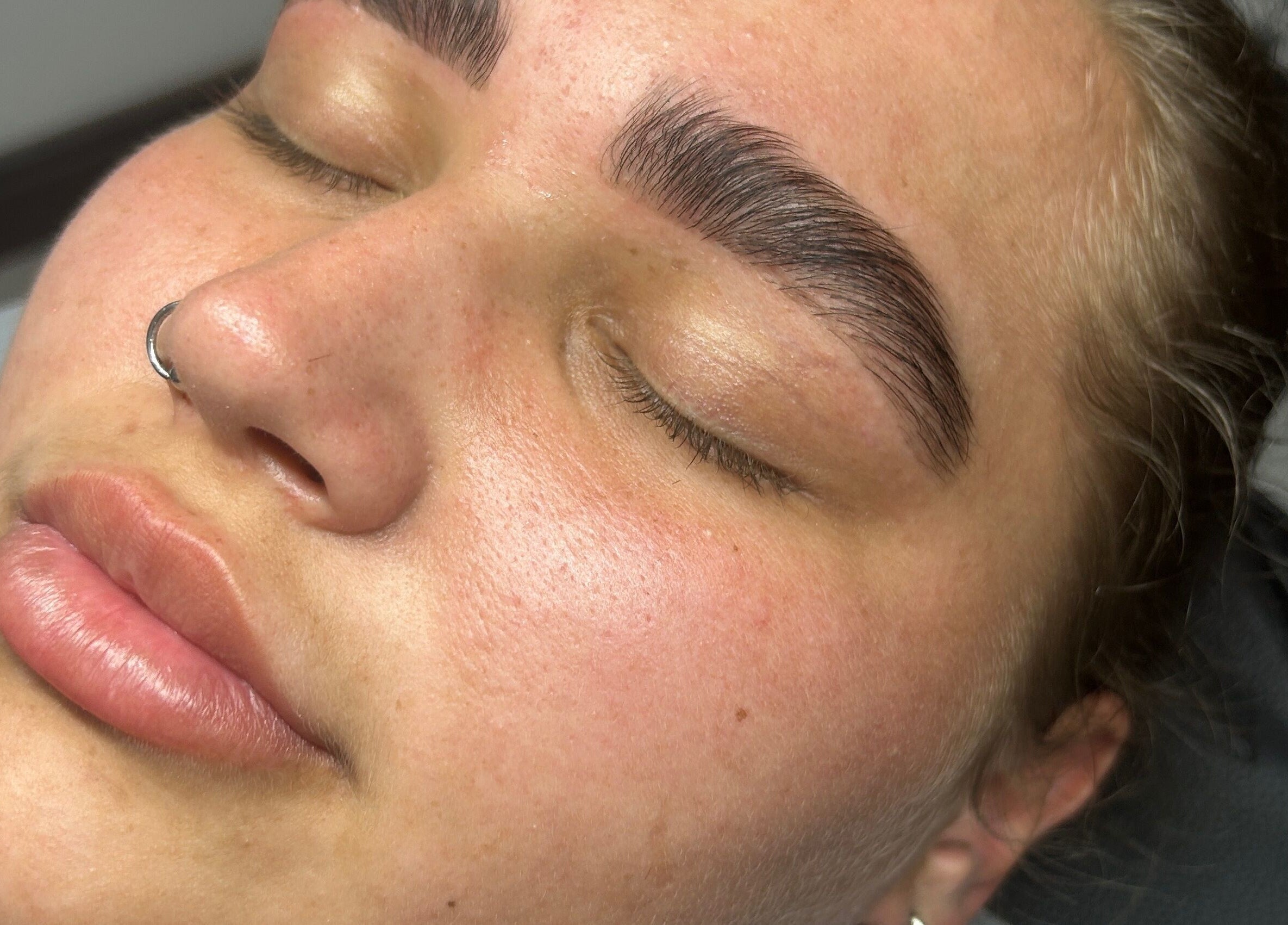 Close-up of freshly shaped brows at Glow Salon, Salford, England, GB, showcasing beauty and wellness.