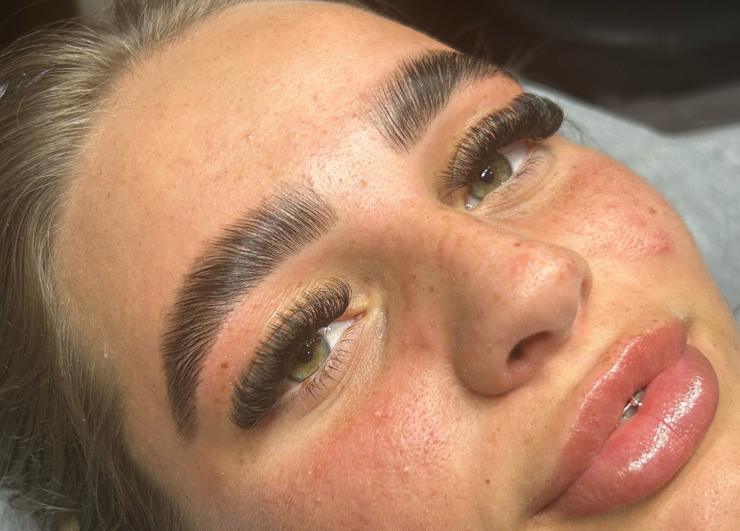 Close-up of sculpted eyebrows at Glow Salon, Salford, England, GB showcasing beauty enhancement.