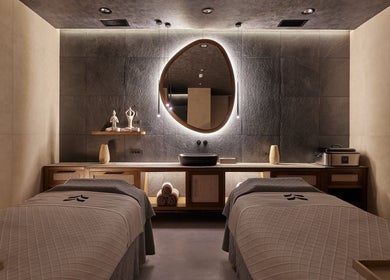 Elegant treatment room at Vassa Spa BOR Hotel by Karisma, Zlatibor, RS with ambient lighting and plush decor.