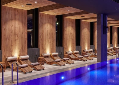 Luxurious relaxation area at Vassa Spa BOR Hotel by Karisma, Zlatibor, RS with poolside seating and ambient lighting.